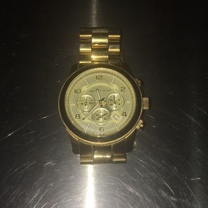 Gold woman’s michael Khors watch